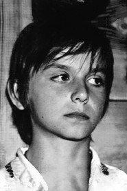 Oleh Polstvin as Heorhiy as a child in The White Bird Marked with Black 1972