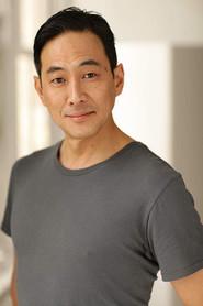 Paul Juhn as Cop #1 in The History of Future Folk 2012