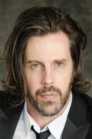 Justin Michael Carriere as The Preacher in Six Guns for Hire 