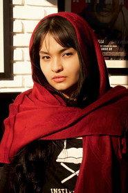 Flávia Dantas as Masked faithful in God Bless You 