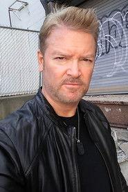 Roy William Gardner as Mr. Monk in Coup! 2024