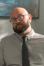 Albert De San Martino as Detective Britten Smith in I Don't Like It Here 2025