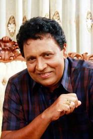 Vijaya Nandasiri as Sakalasuriya 'Mudalali' in Pissu Trible 2003