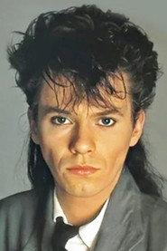 Andy Taylor as Self - Duran Duran, Inductee (archive footage) in 2022 Rock & Roll Hall of Fame Induction Ceremony 2022