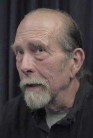 Tom Neyman as The Master (archive footage) in Hotel Torgo 2004