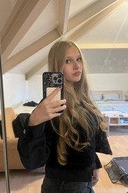Nina Janssen as Hallie in I'm Right Over Here, Why Can't You See Me? 2026