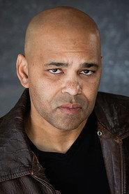 Jamil C. Winston as Doctor Lund in The Business of Christmas 2020