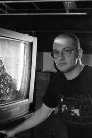 Charles Émond as Seated Men / Passerby (archive footage) in VHS (Video Heterotopic System) 2023