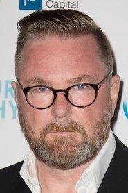 Michael Caton-Jones as Self - Filmmaker in Leonardo DiCaprio: Most Wanted! 2021