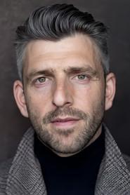 Nicholas Karimi as Iain Campbell in Saving Christmas Spirit 2022