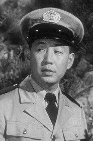 Frank Iwanaga as Security Officer Tomo Iwanaga in Godzilla, King of the Monsters! 1956