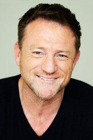 Rob Flanagan as Officer Hartley in Scumbag 2018