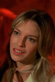 Crystin Sinclaire as Crazy Alice in Caged Heat 1974