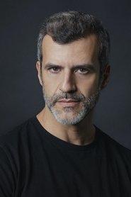 Juan Pablo Olyslager as Father Marco in Free Dead or Alive 2022