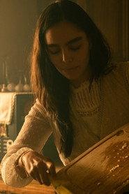 Grecia Tovled as Luisa in What we left Unwatered. 2026