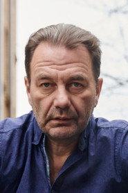 Andris Daugaviņš as Harijs Kuharjonoks in The Foundation of Criminal Excellence 2018