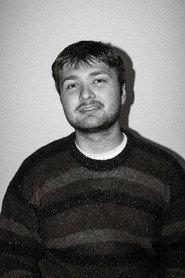 Harry Wharmby as Beach Goer /  Dead Noir Bystander in Retrospect 2024
