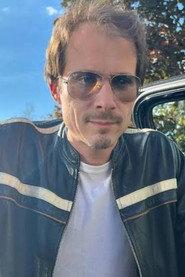 Charls Carroll as Sam Archer in The Sinister Illusion 2024