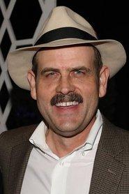 Spike Brandt as Mr. HB (voice) in Scooby-Doo! The Sword and the Scoob 2021