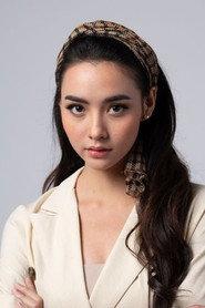 Mookda Narinrak as Paeng in Wooden Buddha 2026