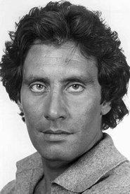 John Leslie as Nick Popodopolis in It's Called 'Murder', Baby 1983
