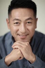 Guo Tiecheng as District Chief Jia in Never Stop 2021