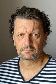 Roman Slovák as Police Officer 1 in Kotrmelce pana herce 2025