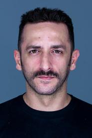 Fotis Lazarou as Kroupis in The Meaning of August 2020