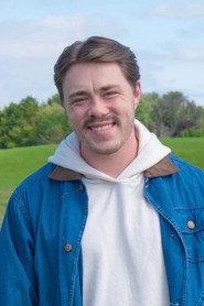 Justin Haas as Josh in Reaper Road 2026