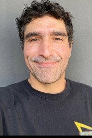 João Cândido as Barman in Between Root and Wings 2022
