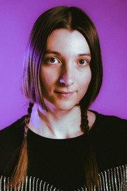 Emma Hough Hobbs as Assistant Director in Unturnoffable Garnet Anniversary Holiday Reunion Special 