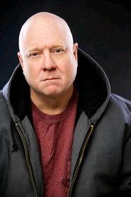 Robin Winton as The Boss in Taking Care of Business 2025