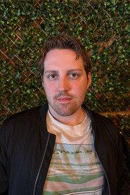 Caleb Johns as Thomas Turnbo in Semi-Divine 2025