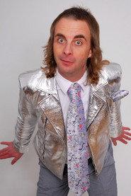 Paul Foot as Smug Presenter in The Apocalypse Box 2024