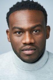 Onye Eme-Akwari as Nollywood Film Clip in Jaja's African Hair Braiding 2023
