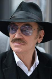 Mikhail Boyarskiy as Titi Suru the Wolf in Mama 1977