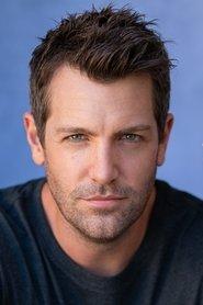 Tim Ross as Father Michael in Missed Opportunities 2025