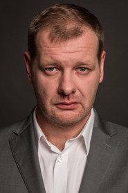 Krzysztof Pluskota as Stanisław Mocek in JJ 2014