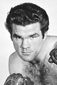 Freddie Mills as Harry the Scar in Fun at St. Fanny's 1955