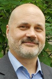 Trevor M. Przyuski as Doctor Vaughn in Along Came the Dark 2021