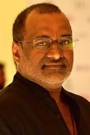 Anil Kumar as Rakesh Patel in American Desi 2001