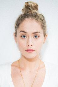 Elke Shari Van Den Broeck as Front desk assistant in The Pod Generation 2023