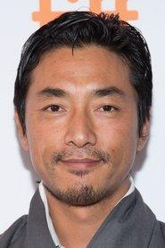 Tshering Dorji as Postmaster in Travellers and Magicians 2003