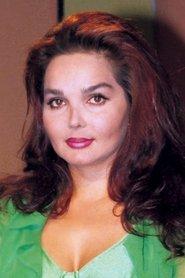 Songül Ülkü as The Teacher in Motherland Hotel 1987
