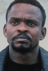 Albee Lesotho as Essomba Tourneur in Aristotle's Plot 1997