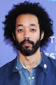 Wyatt Cenac as Babatunde in Hits 2014