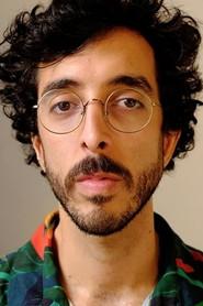 Caio Scot as Rogério Duarte in Meu Nome é Gal 2023