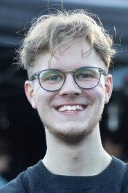 Liam Carr as Wedding Guest in Two Lips and Daisies
