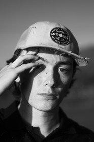 Patrick Hayashi as Derek in L'ombre de L'arme 2026