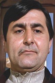 Jean Cherlian as Minister of Economic Affairs in Helga: She Wolf of Stilberg 1977